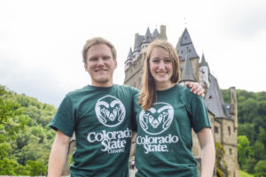 Two CSU students in Germany pose in front of a castle