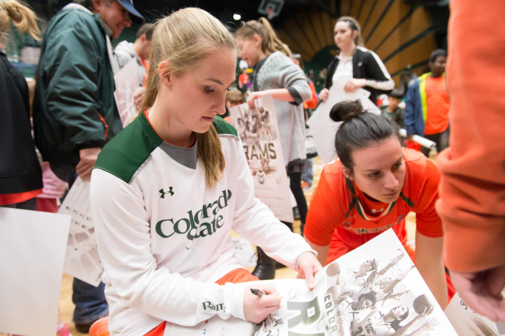 players signing posters