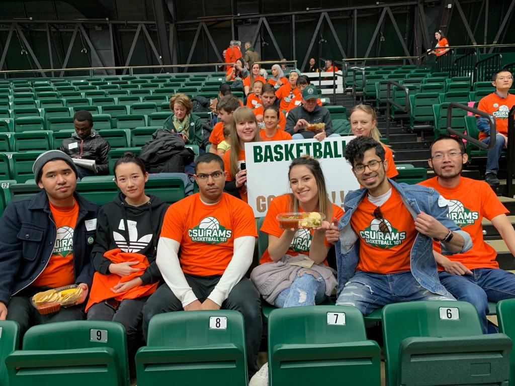 group of students at a basketball game in the stands