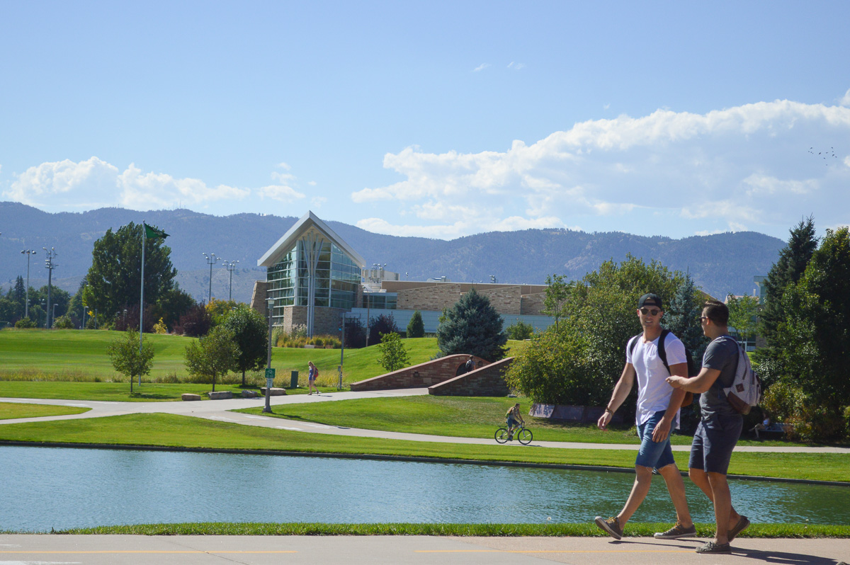 Students walk along the lagoon at Colorado State University in Fort Collins, CO