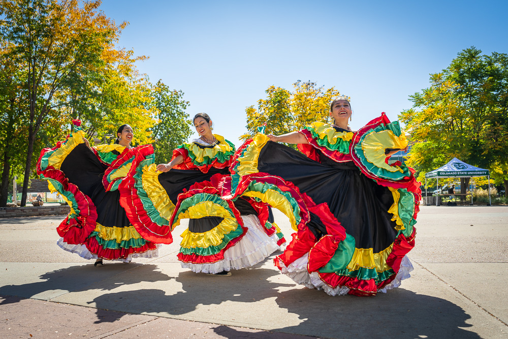 three flamenco dancers perform outside of the lory student center