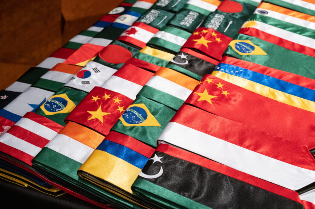 A group of colorful flags folded on a table