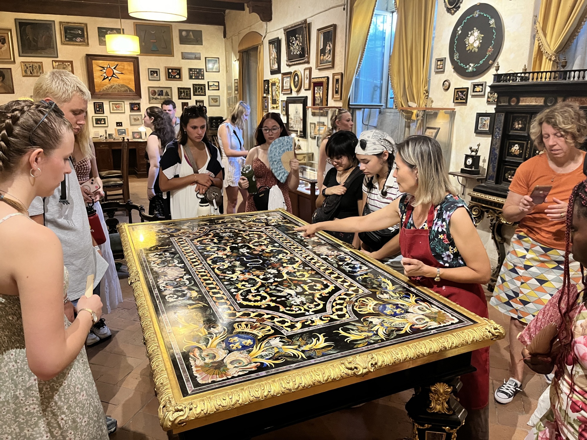A group stands around a decorative table