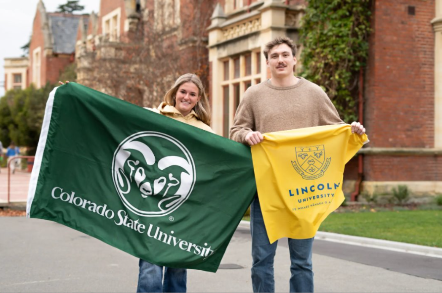 Two students holding flags