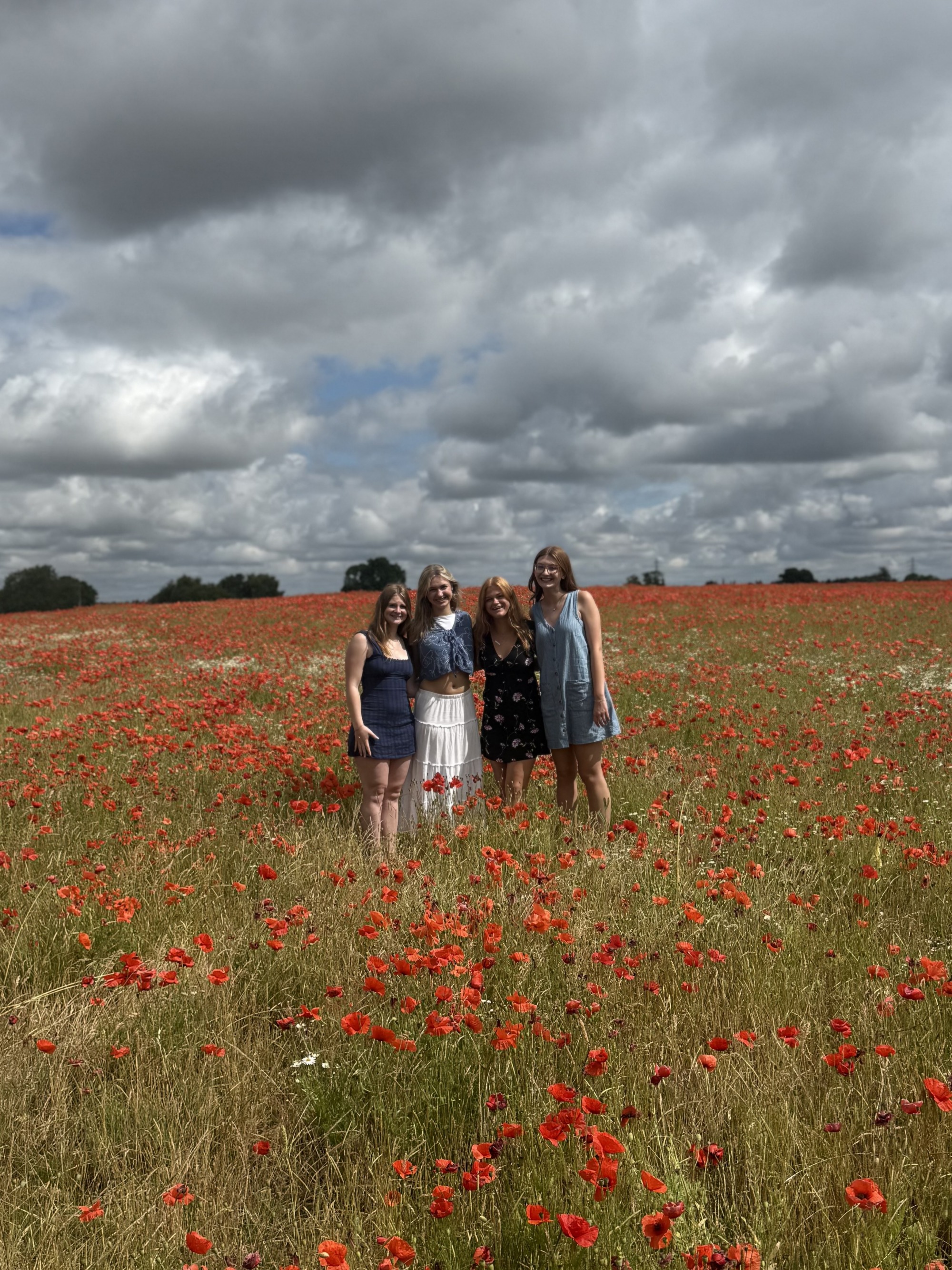 A group of girls in a field of flowers