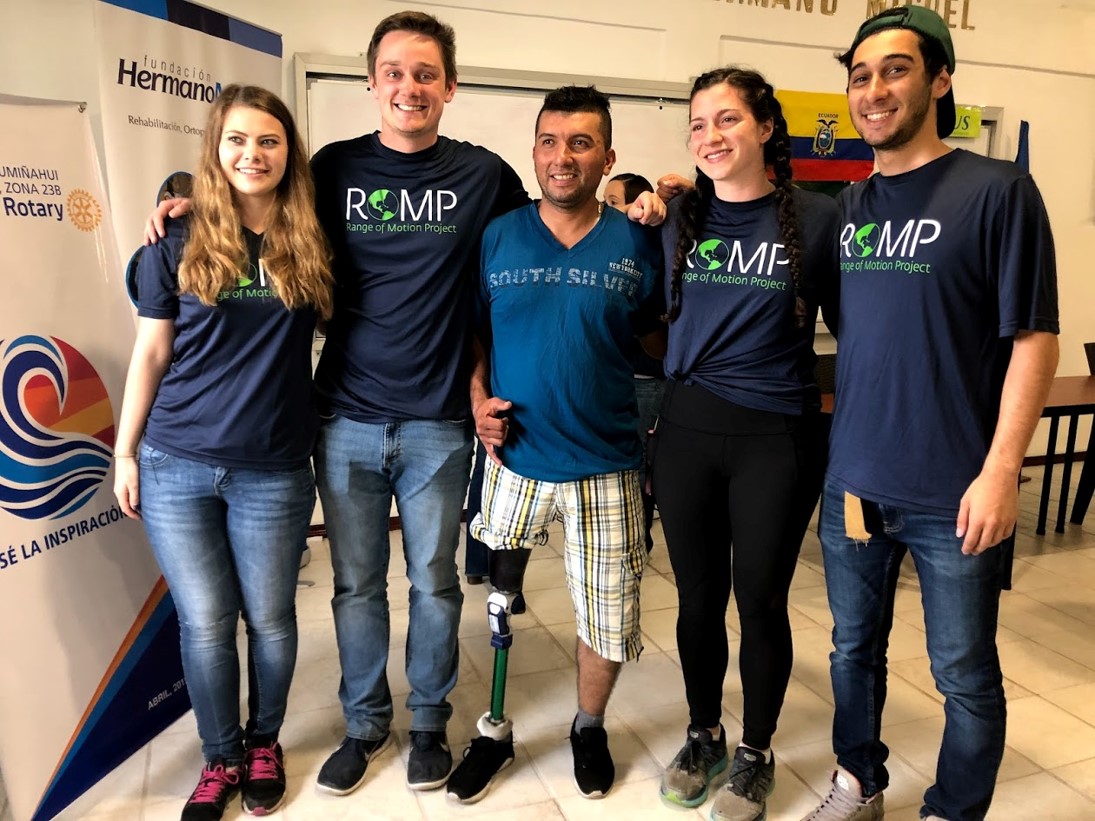 A group wearing ROMP (Range of Motion Project) t-shirts