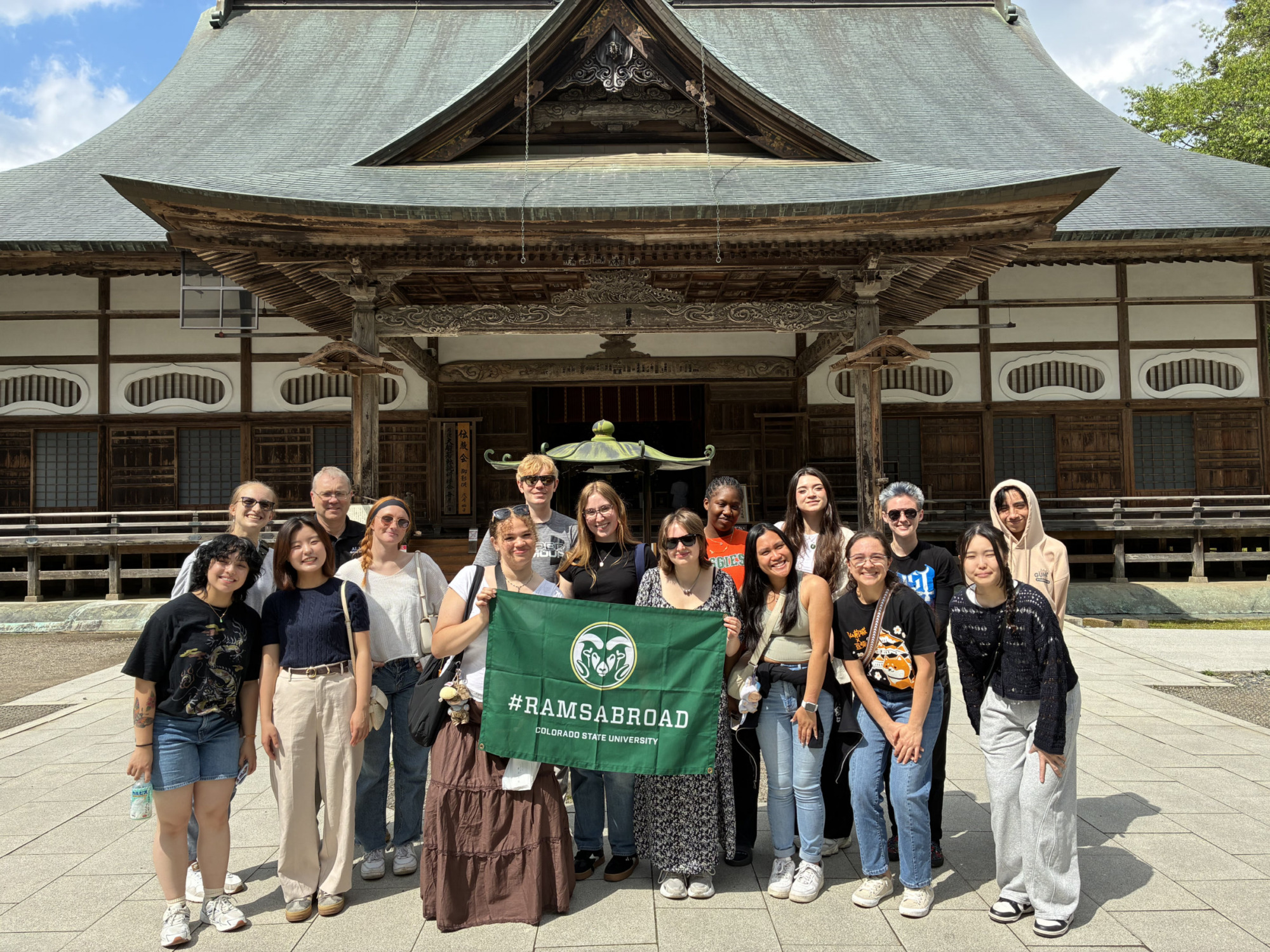 A group of students in front of a temple