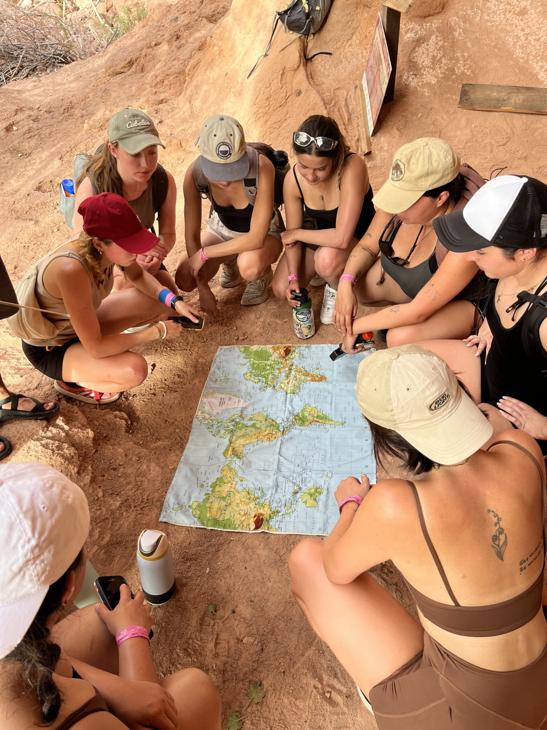 A group of students around a map