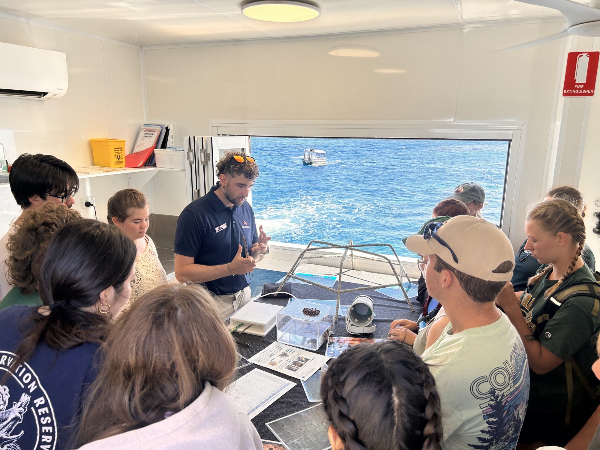 Biology students working on a project near the ocean
